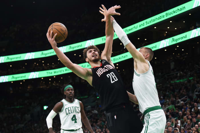 Houston Rockets center Alperen Sengun finishes over Boston Celtics center Kristaps Porzingis